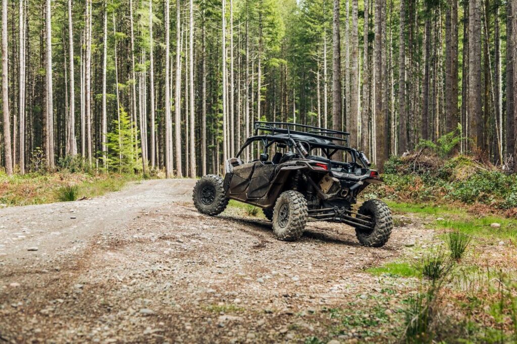 an off road vehicle in the woods.