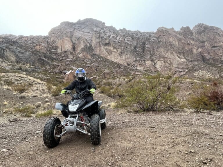Explore Nevadas thrilling landscape on a black ATV! Join Las Vegas RZR off-road tours through rugged cliffs near the Colorado River.