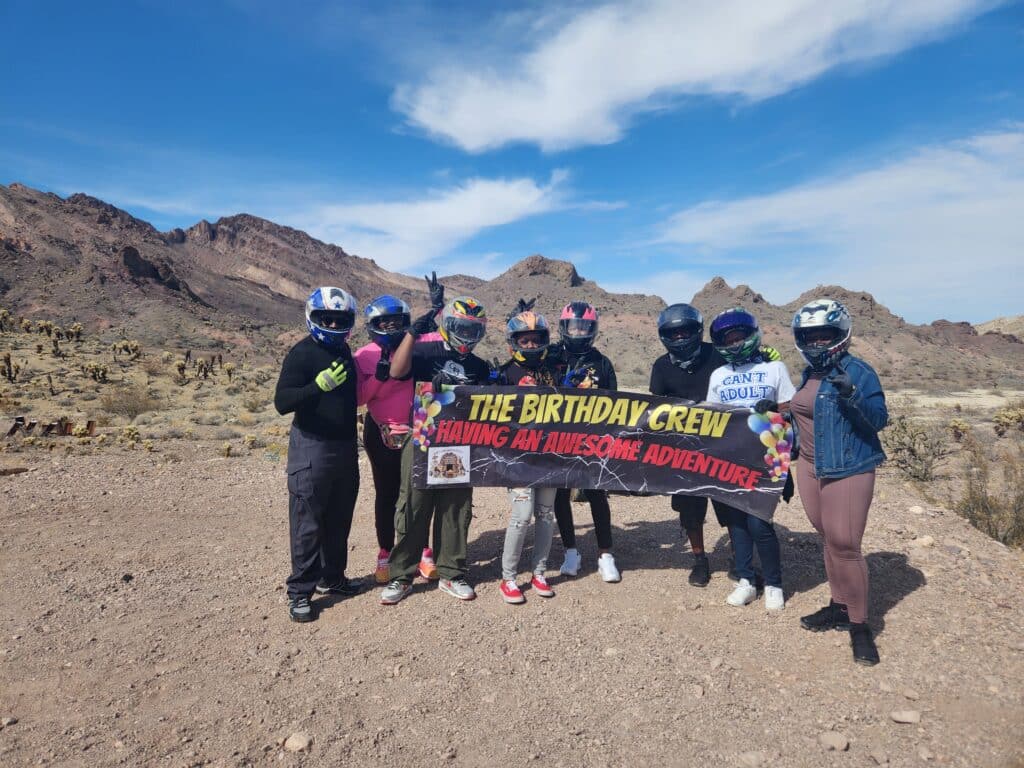 Birthday Crew’s Awesome Nevada Adventure: Helmeted group savors ATV tours near Las Vegas with scenic Colorado River backdrop!.