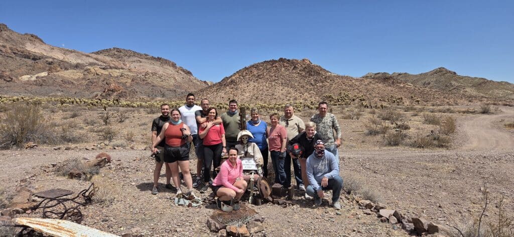 Group enjoying an ATV tour near Las Vegas in Nevada’s rocky desert, with Colorado River and mountains in the background.