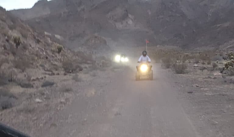 Experience an exhilarating ATV tour near Las Vegas, riding RZRs on dusty Nevada trails through rocky desert and scenic mountain views.