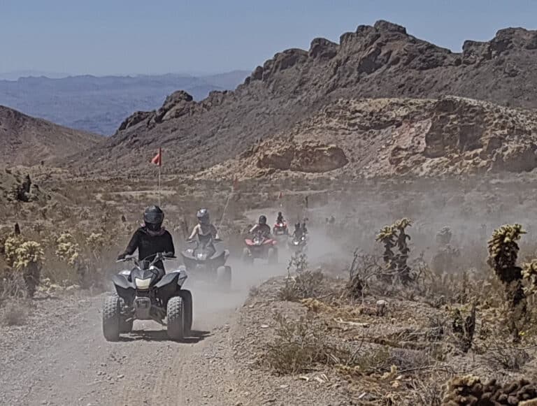 Experience thrilling ATV tours near Las Vegas, Nevada, riding dusty desert trails by rocky hills and the scenic Colorado River.