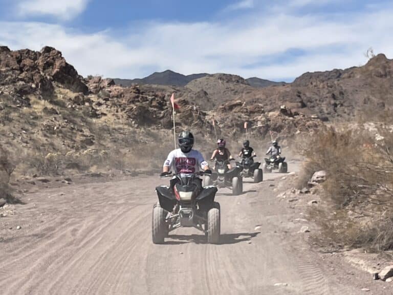 Experience an exciting ATV tour near Las Vegas, Nevada, riding dusty desert trails with mountain views by the Colorado River.
