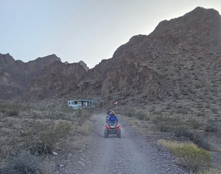 Experience an ATV tour near Las Vegas, Nevada—ride a rocky desert trail with mountain views and a ghost town’s abandoned bus in sight.