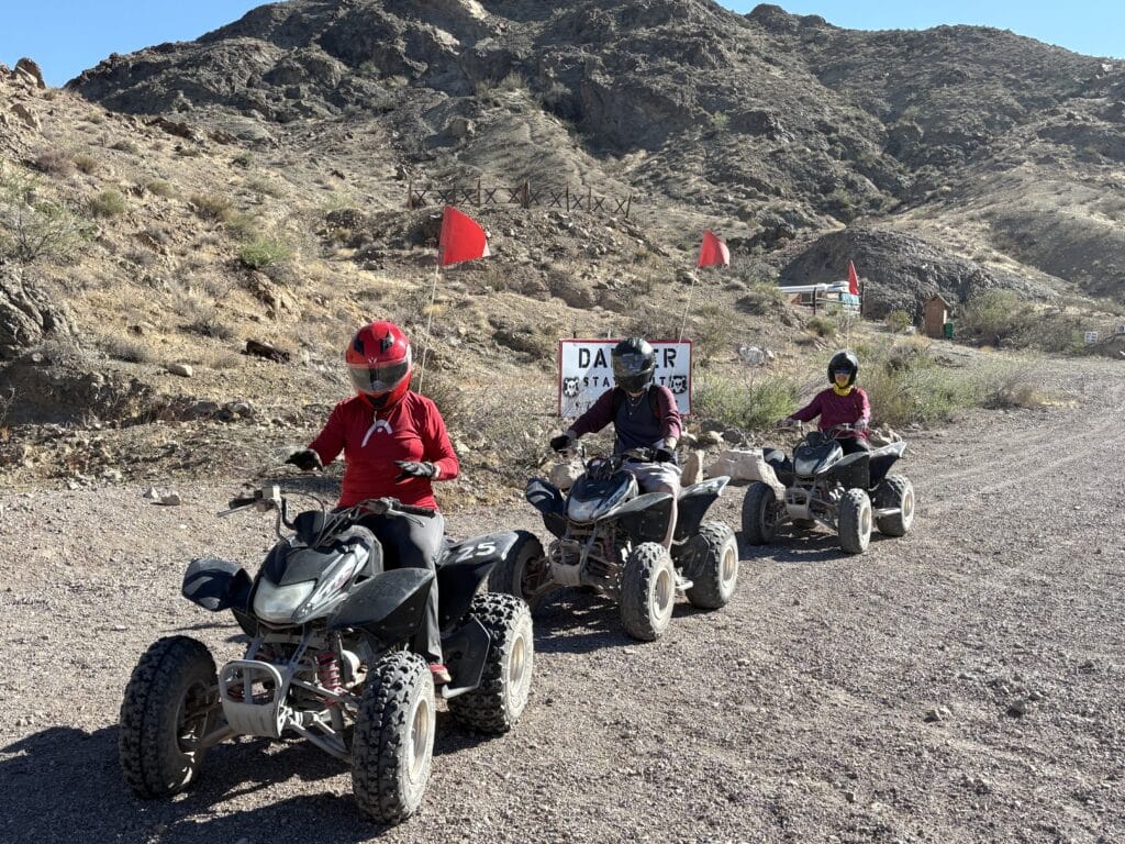 Explore Nevada’s desert near Las Vegas on an ATV tour—ride RZRs with red flags past hills and Ghost Towns by the Colorado River!.