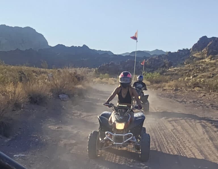 Experience thrilling ATV tours near Las Vegas, Nevada—ride dusty trails by rocky desert mountains under clear blue skies!.