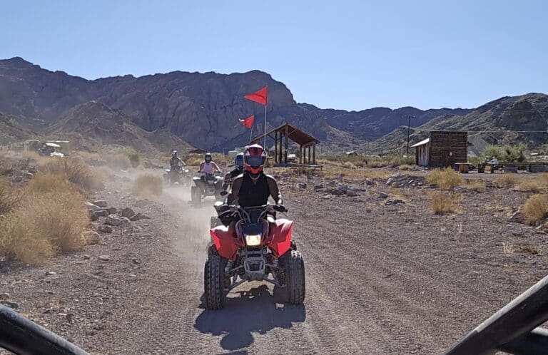 Experience thrilling Las Vegas ATV tours on a red ATV through Nevada’s desert trails near the Colorado River and Ghost Towns.