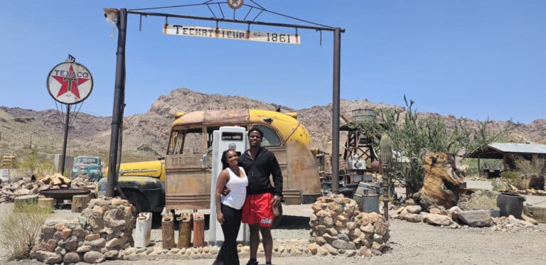 Smiling in Techatticup Ghost Town near Las Vegas, Nevada—perfect for ATV tours, RZR rides, and Colorado River sightseeing!.