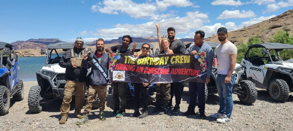 A group of nine enjoy an ATV tour by the Colorado River near Las Vegas, Nevada, with RZR rides and Ghost Town sightseeing.