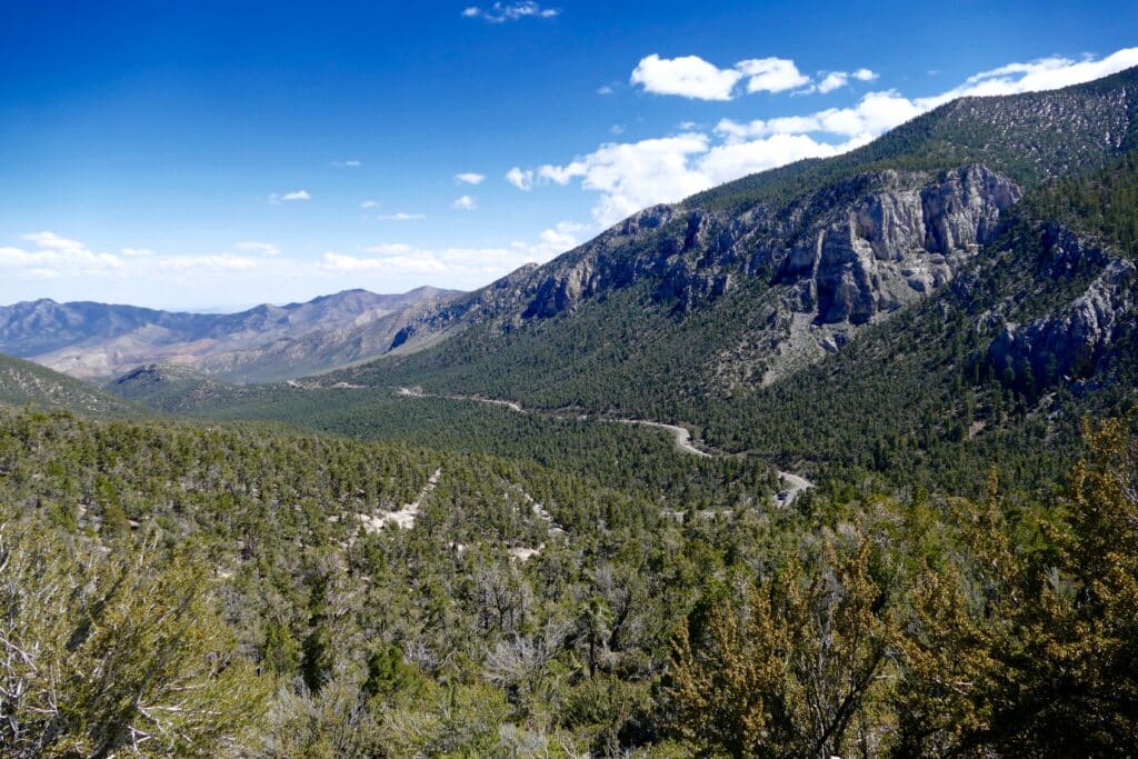 Experience a scenic ride on a winding Nevada mountain road near Las Vegas, with ATV tours and Colorado River views.
