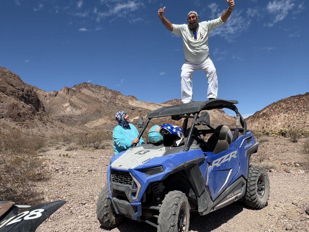 Adventurers enjoy a Polaris RZR ride in Nevada’s rocky desert near Las Vegas, perfect for off-road ATV tours and mountain views.