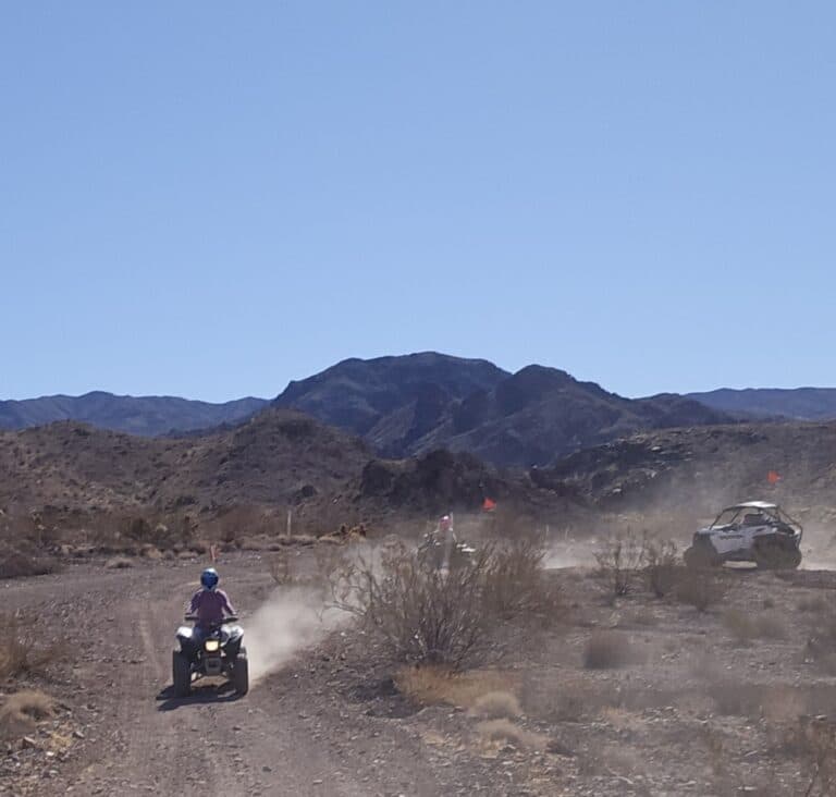 ATV tours and RZR off-road rides near Las Vegas, Nevada, with dusty trails, desert scenery, and distant mountains under blue skies.
