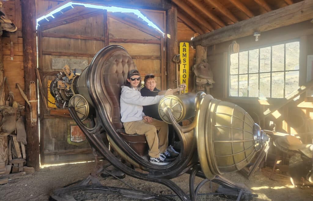 Experience a steampunk time machine in a rustic Nevada ghost town, with saddles, tools, and sunlight—perfect for sightseeing tours.
