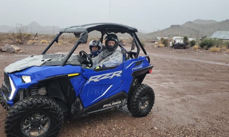 Exploring Nevada’s desert near Las Vegas in a Polaris RZR on a muddy ATV tour, with Ghost Town sights and mountain views.