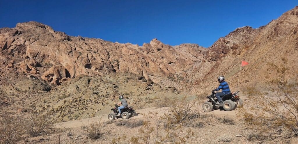 Adventure seekers on ATVs explore Eldorado Canyon near Las Vegas, Nevada, with scenic desert views and Ghost Town sightseeing.