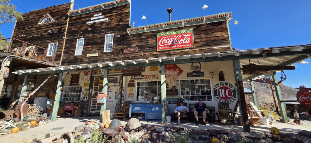 Historic Nevada general store with Coca-Cola sign, antiques, and desert backdrop near Las Vegas—perfect for Ghost Town sightseeing.