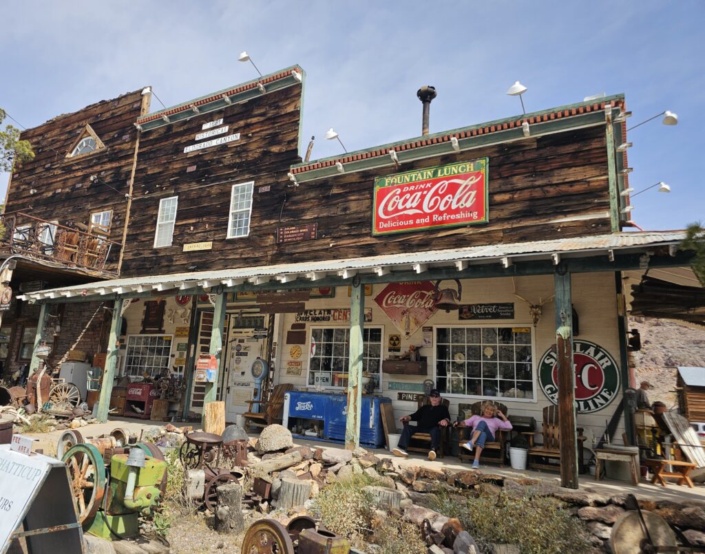Vintage wooden building near the Colorado River in Nevada, rustic antiques, Coca-Cola sign; perfect for Ghost Town sightseeing.
