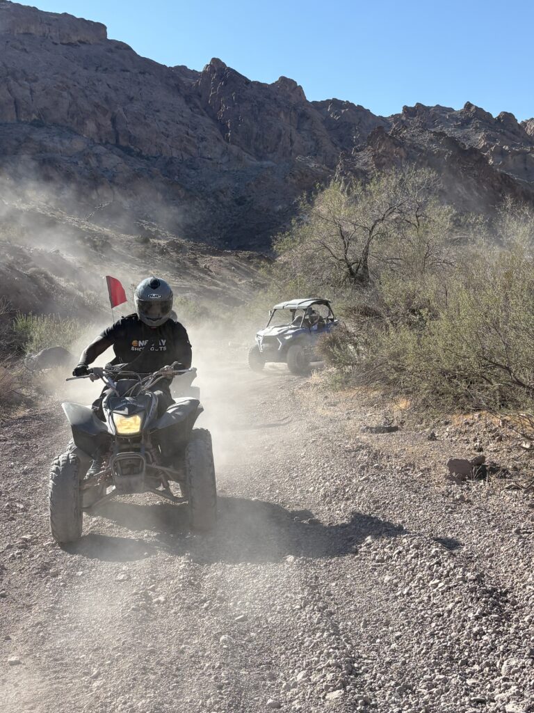 ATV and RZR off-road tour near Las Vegas: riders explore dusty Nevada trails with desert views and mountain backdrops.