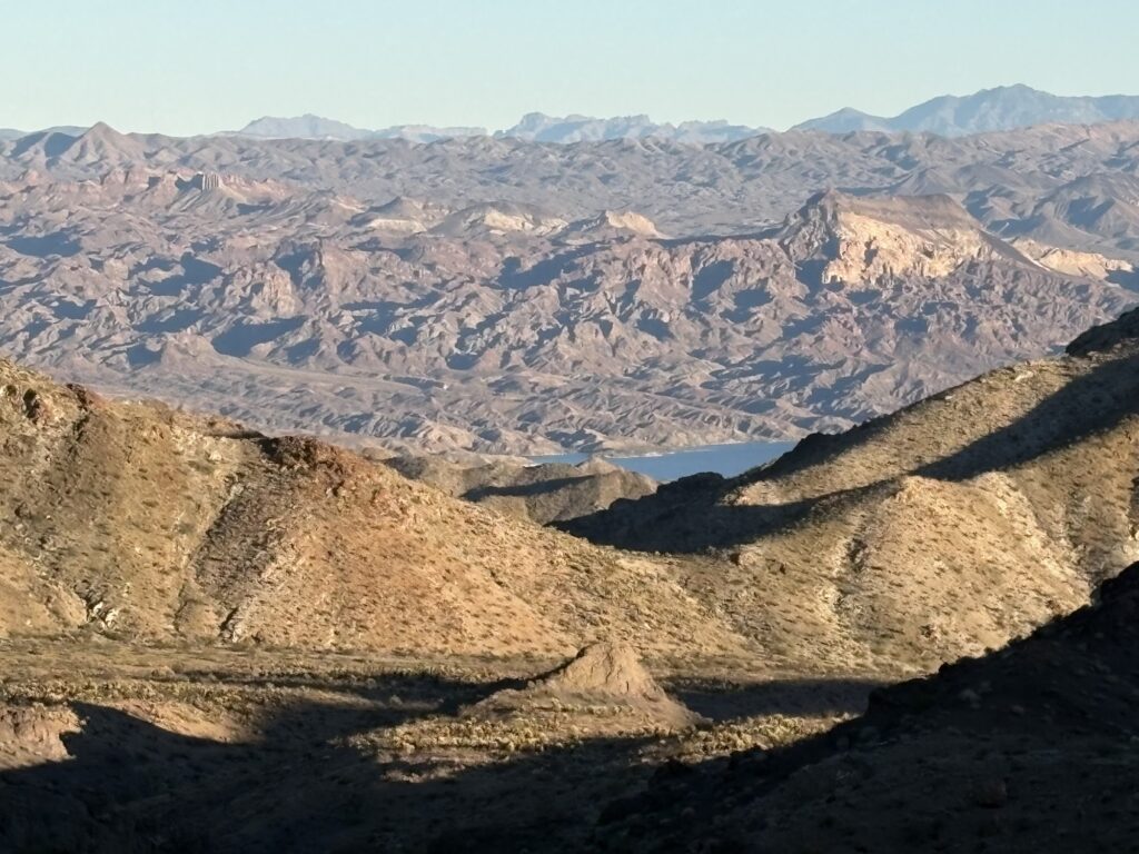 Rugged Nevada desert near Las Vegas with rocky ridges, valleys, Colorado River views—ideal for ATV tours and RZR off-road rides.